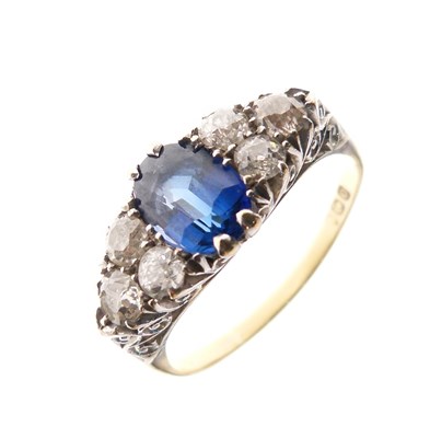 Lot 13 - Sapphire and diamond 18ct gold cluster ring