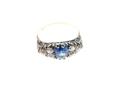 Lot 13 - Sapphire and diamond 18ct gold cluster ring