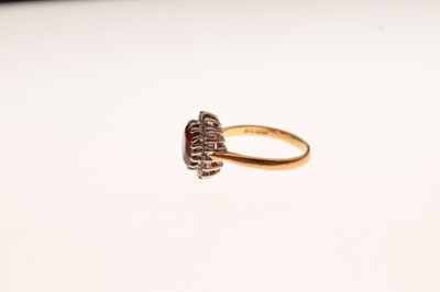 Lot 27 - 18ct gold cluster ring set diamonds and garnet-coloured stone