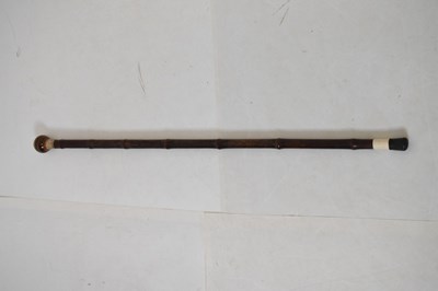 Lot 245 - Bamboo cane with ‘tiger eye’ knob