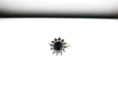 Lot 8 - 9ct sapphire and diamond set ring