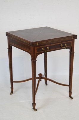 Lot 534 - Edwardan inlaid mahogany 'envelope' card table