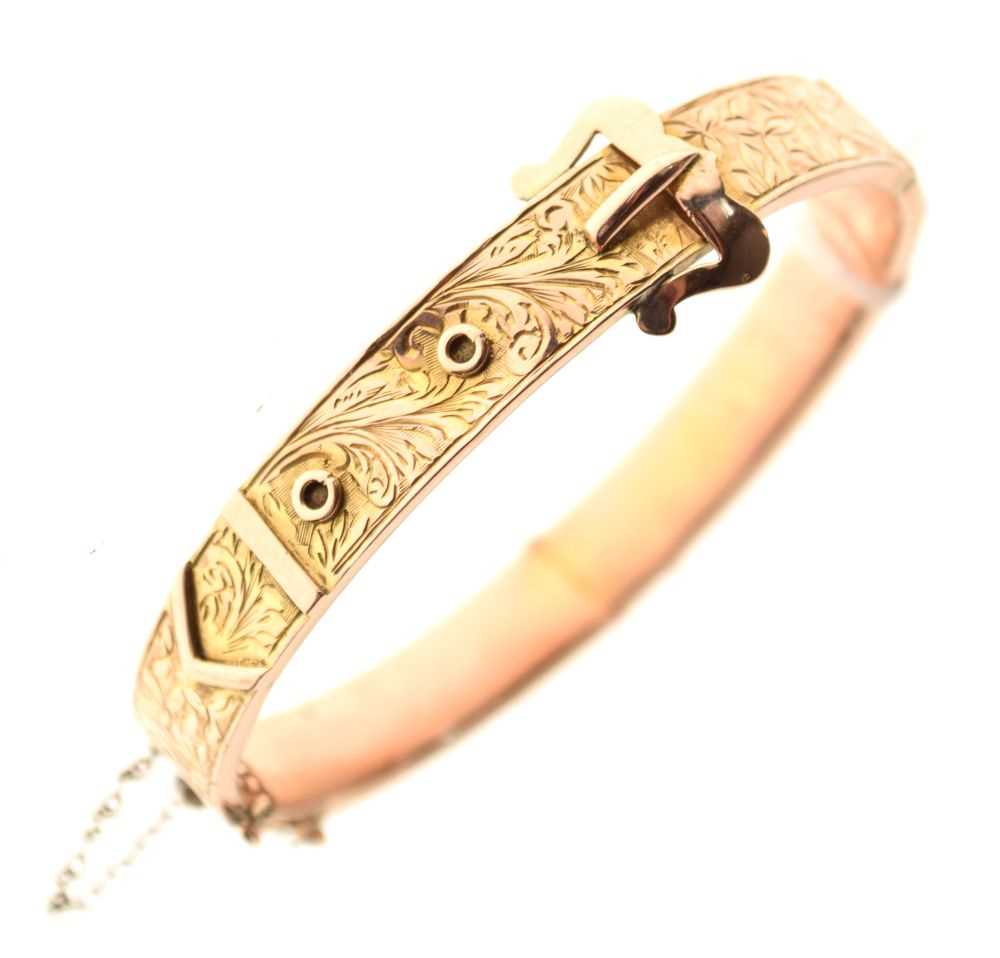 Lot 40 - 9ct gold engraved belt-buckle design snap bangle