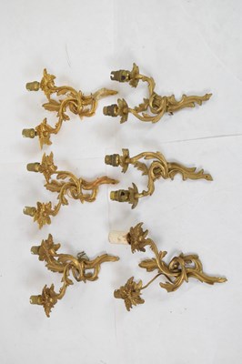 Lot 648 - Two pairs of gilt metal wall foliate scroll wall lights