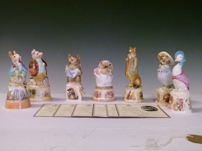 Lot 396 - Seven Royal Worcester 'Beatrix Potter' candle snuffers