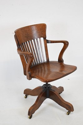 Lot 518 - Mangus & Co, London 'Captain's' oak swivel chair