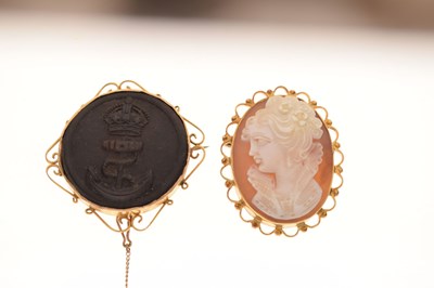 Lot 46 - Royal Navy pressed horn button and a shell cameo brooch (2)