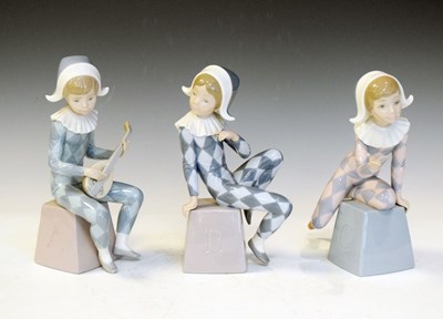 Lot 419 - Lladro - Three porcelain child Pierrot figures