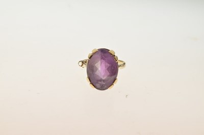 Lot 8 - 9ct gold dress ring set oval amethyst-coloured stone