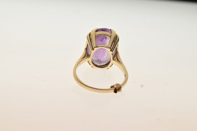 Lot 8 - 9ct gold dress ring set oval amethyst-coloured stone