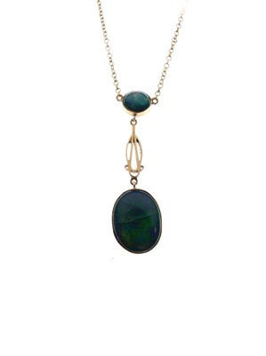 Lot 75 - Yellow metal (9ct) and black opal pendant with oval drop
