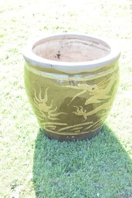 Lot 690 - Group of three Chinese brown glazed stoneware urns with dragon decoration