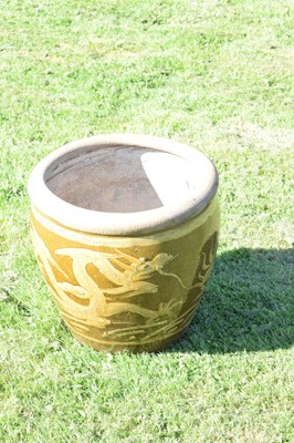 Lot 690 - Group of three Chinese brown glazed stoneware urns with dragon decoration