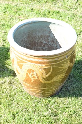 Lot 690 - Group of three Chinese brown glazed stoneware urns with dragon decoration