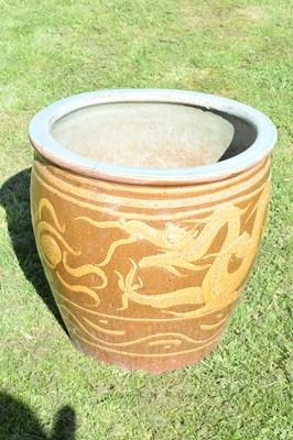 Lot 690 - Group of three Chinese brown glazed stoneware urns with dragon decoration