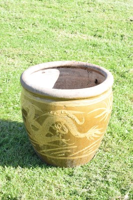 Lot 690 - Group of three Chinese brown glazed stoneware urns with dragon decoration