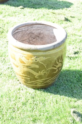 Lot 690 - Group of three Chinese brown glazed stoneware urns with dragon decoration
