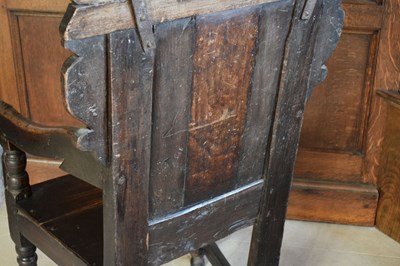 Lot 20 - Charles II oak panel-back open armchair