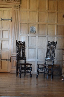 Lot 83 - Pair of late 17th Century carved oak high-back chairs
