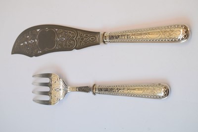 Lot 128 - Late Victorian silver fish serving set and George III basting spoon