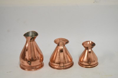 Lot 433 - Set of copper jugs