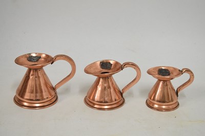 Lot 433 - Set of copper jugs