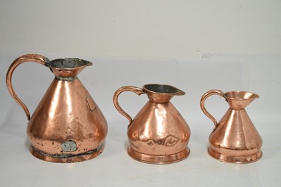 Lot 433 - Set of copper jugs