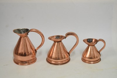 Lot 433 - Set of copper jugs