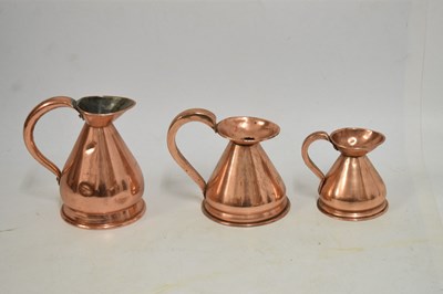 Lot 433 - Set of copper jugs