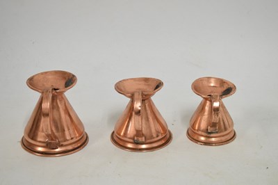 Lot 433 - Set of copper jugs