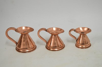 Lot 433 - Set of copper jugs