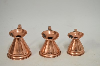 Lot 433 - Set of copper jugs