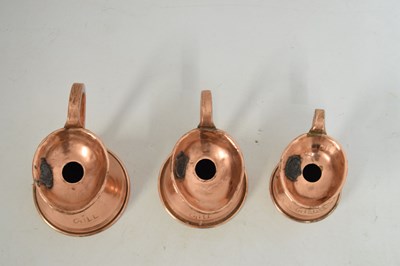 Lot 433 - Set of copper jugs