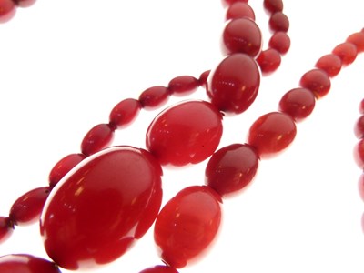 Lot 90 - Two cherry amber necklaces