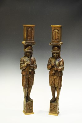 Lot 466 - Pair of carved oak figures playing flutes