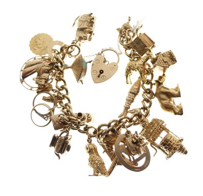 Lot 73 - 9ct gold curb link charm bracelet