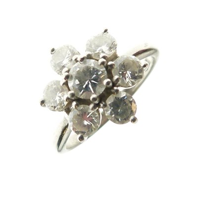Lot 278 - Seven-stone diamond flower head cluster ring