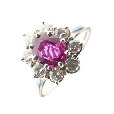 Lot 281 - Ruby and diamond 18ct white gold cluster ring