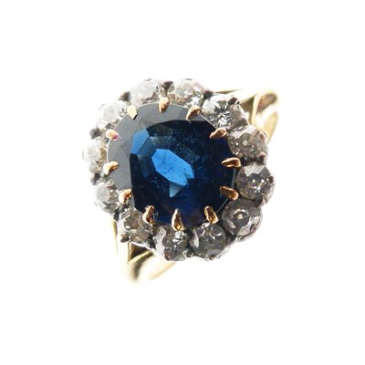 Lot 282 - Sapphire and diamond 18ct gold cluster ring
