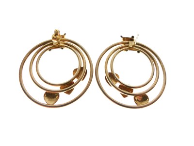 Lot 29 - Pair of bi-colour hoop earrings with heart motifs