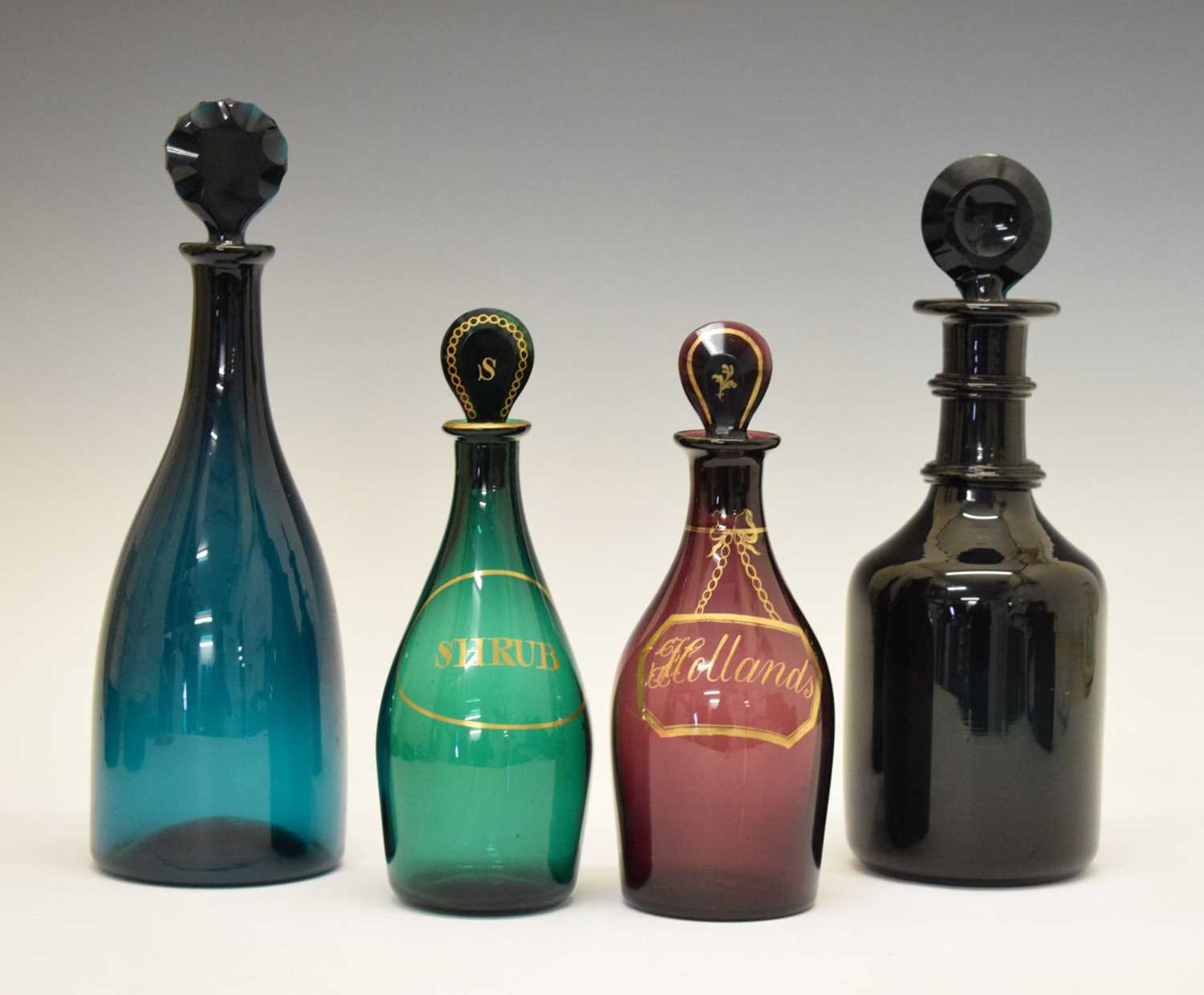 Lot 304 - Four 19th Century coloured glass decanters