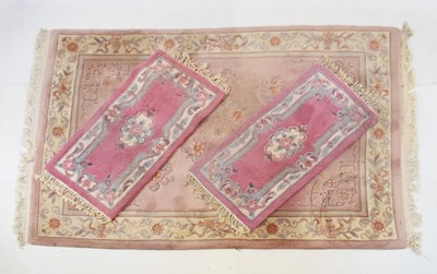 Lot 496 - Chinese pink ground rug