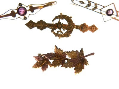 Lot 33 - Four gold brooches