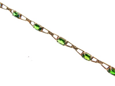 Lot 65 - 9ct gold and green gem-set bracelet