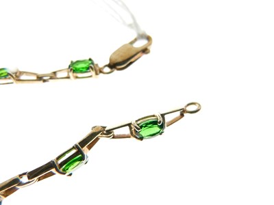 Lot 65 - 9ct gold and green gem-set bracelet