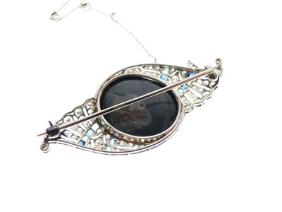 Lot 330 - Black opal, diamond, calibré emerald and sapphire brooch