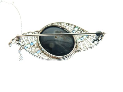 Lot 330 - Black opal, diamond, calibré emerald and sapphire brooch