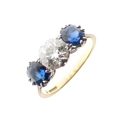 Lot 283 - Three-stone diamond and sapphire 18ct gold ring