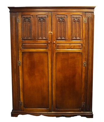 Lot 446 - Early 20th Century oak gothic revival influence wardrobe