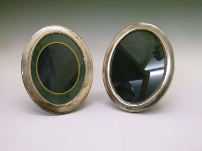 Lot 124 - Pair of silver oval photograph frames
